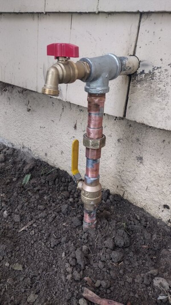 Repaired hose bib and outdoor water shut-off valve with soldered copper pipe.