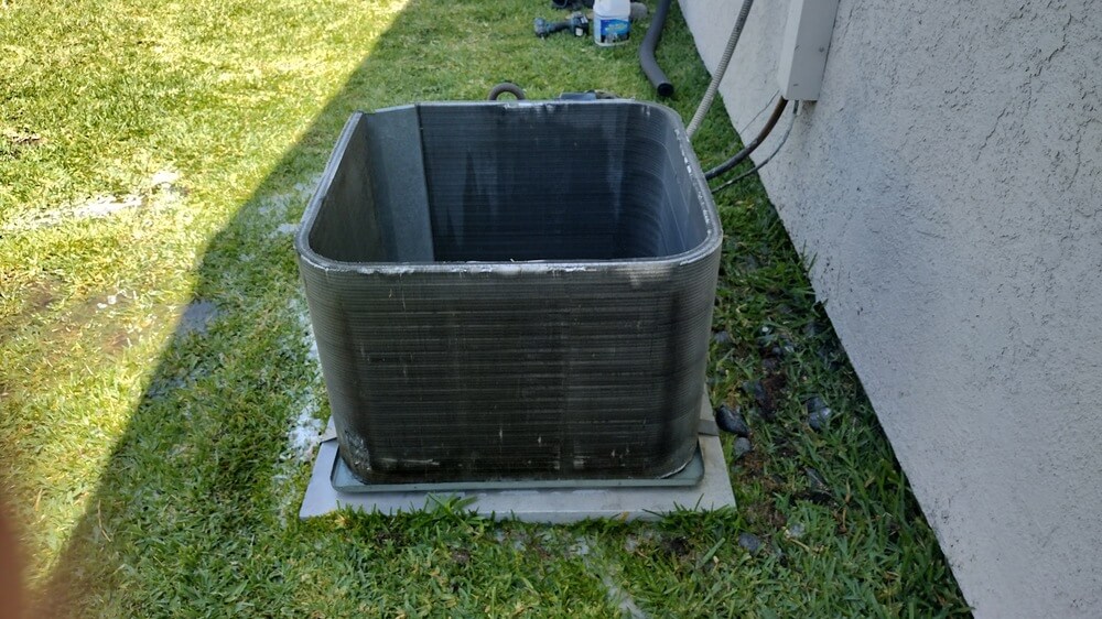 Outdoor HVAC condenser coil cleaned during air conditioning service near Rossmoor, CA.