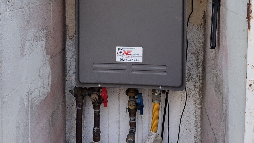 Installed tankless water heater with visible plumbing.