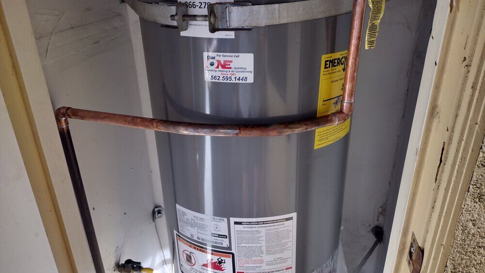 Water heater installation with copper piping, representative of plumbing work Dial ONE Schilling performs for Seal Beach homeowners.