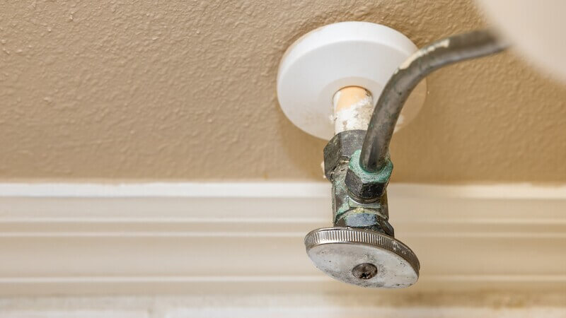 Corroded bathroom shut-off valve in need of repair in Lakewood, CA